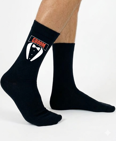 Black socks with 'GROOM' and tuxedo graphic on a white background