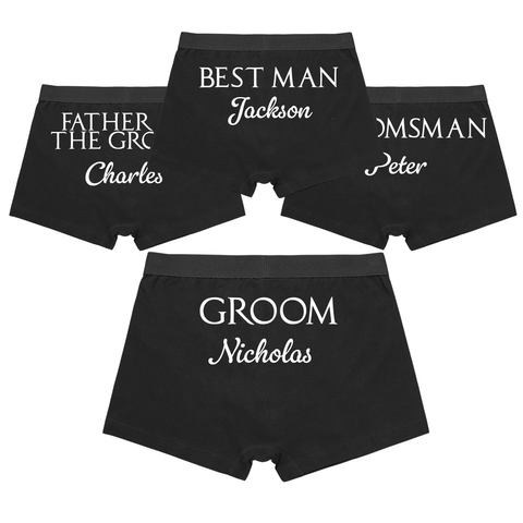 Black boxer briefs with white text for groomsmen on a white background