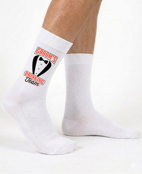 White socks with 'Groom's Drinking Team' print on a white background