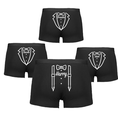 Set of black boxer briefs with white tuxedo and bow tie design on a white background