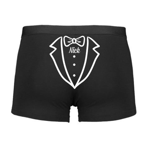 Black boxer briefs with a white tuxedo graphic and 'Nick' text on a white background